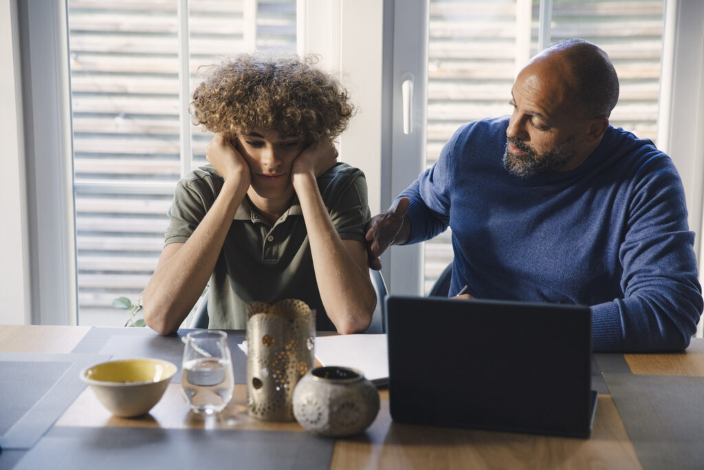 Parent helping child with difficult time