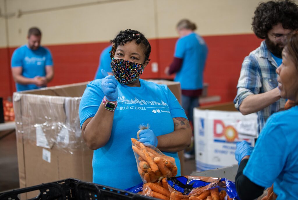 Blue KC volunteer at Harvesters