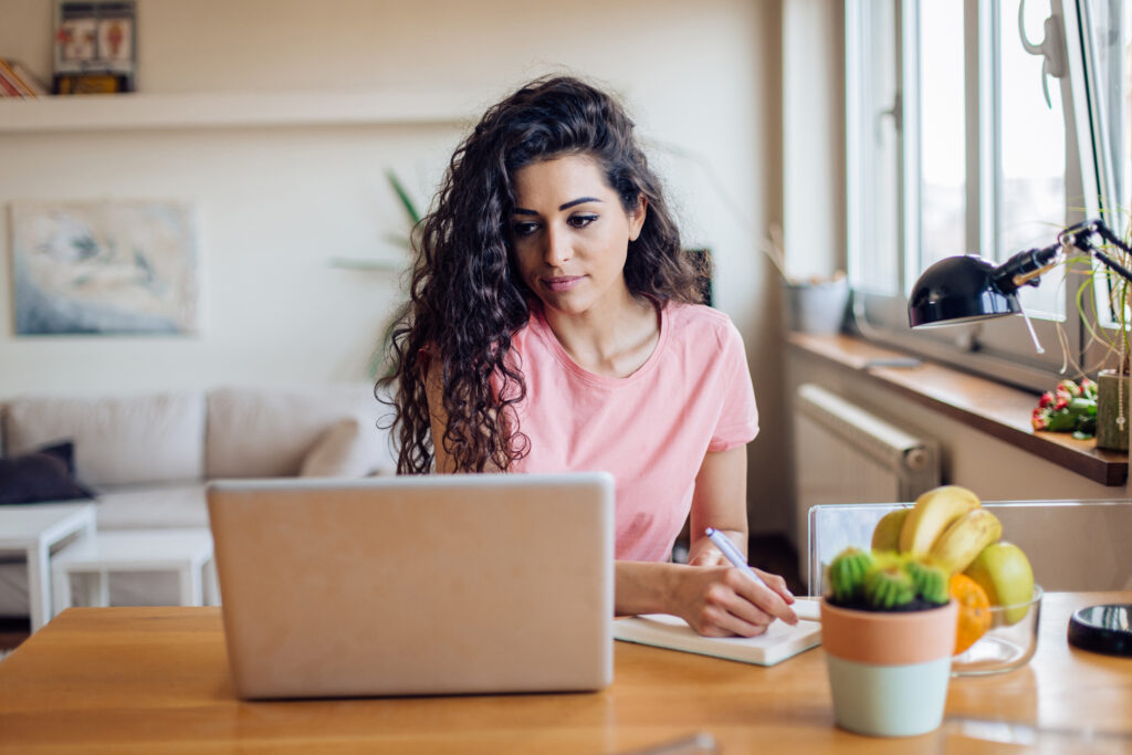 Woman researches online health insurance options